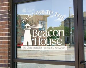 Beacon House logo decal on storefront door window.