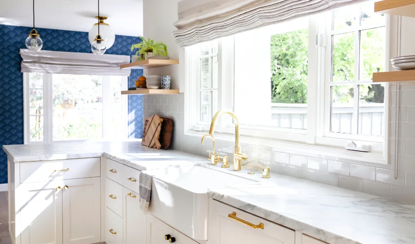 Interior of a spotless clean kitchen with white countertop.